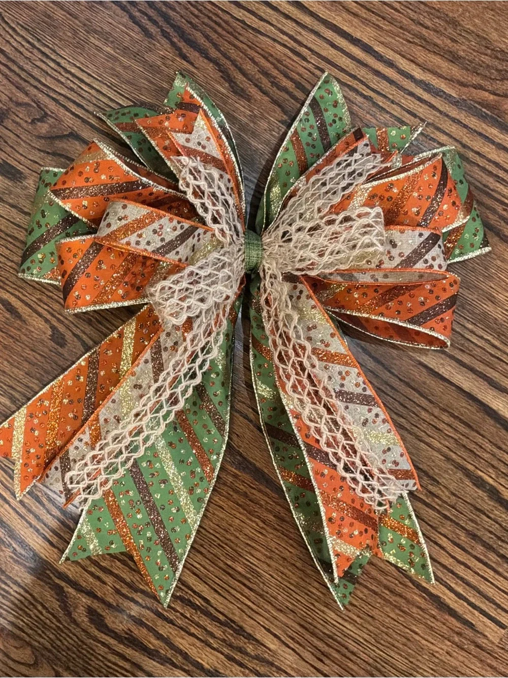 Festive Green and Orange Striped Holiday Bow with Cream Lace Accent